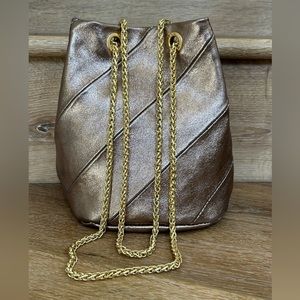 Metallic Bronze Drawstring Crossbody Bag with Gold Chain